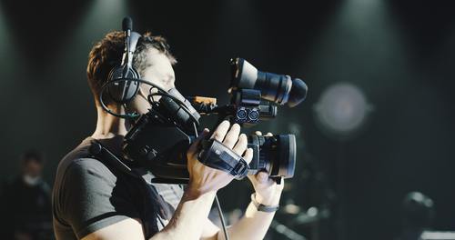 A media workers with a camera | credit collection services